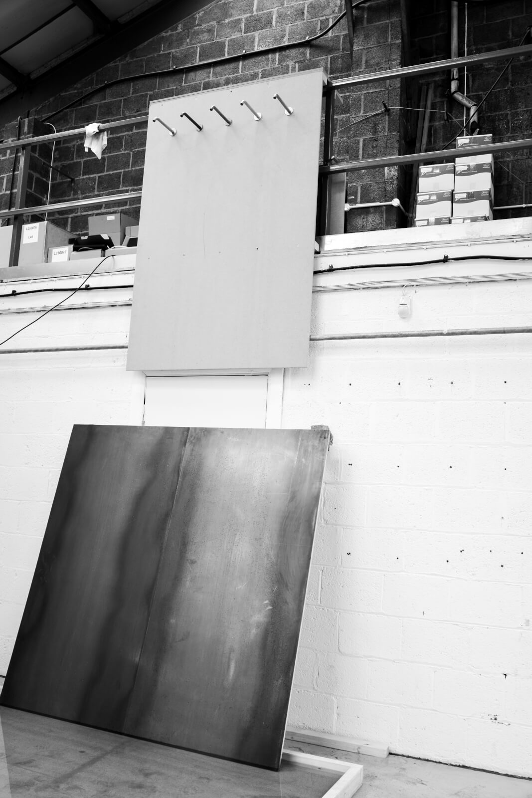 Black and white image of The Splash Lab's four-metre waterfall project featuring 5 capacitive taps