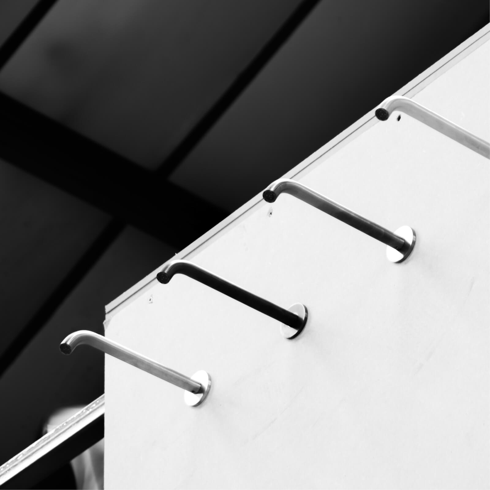 Black and white image of The Splash Lab's four-metre waterfall project featuring 5 capacitive taps
